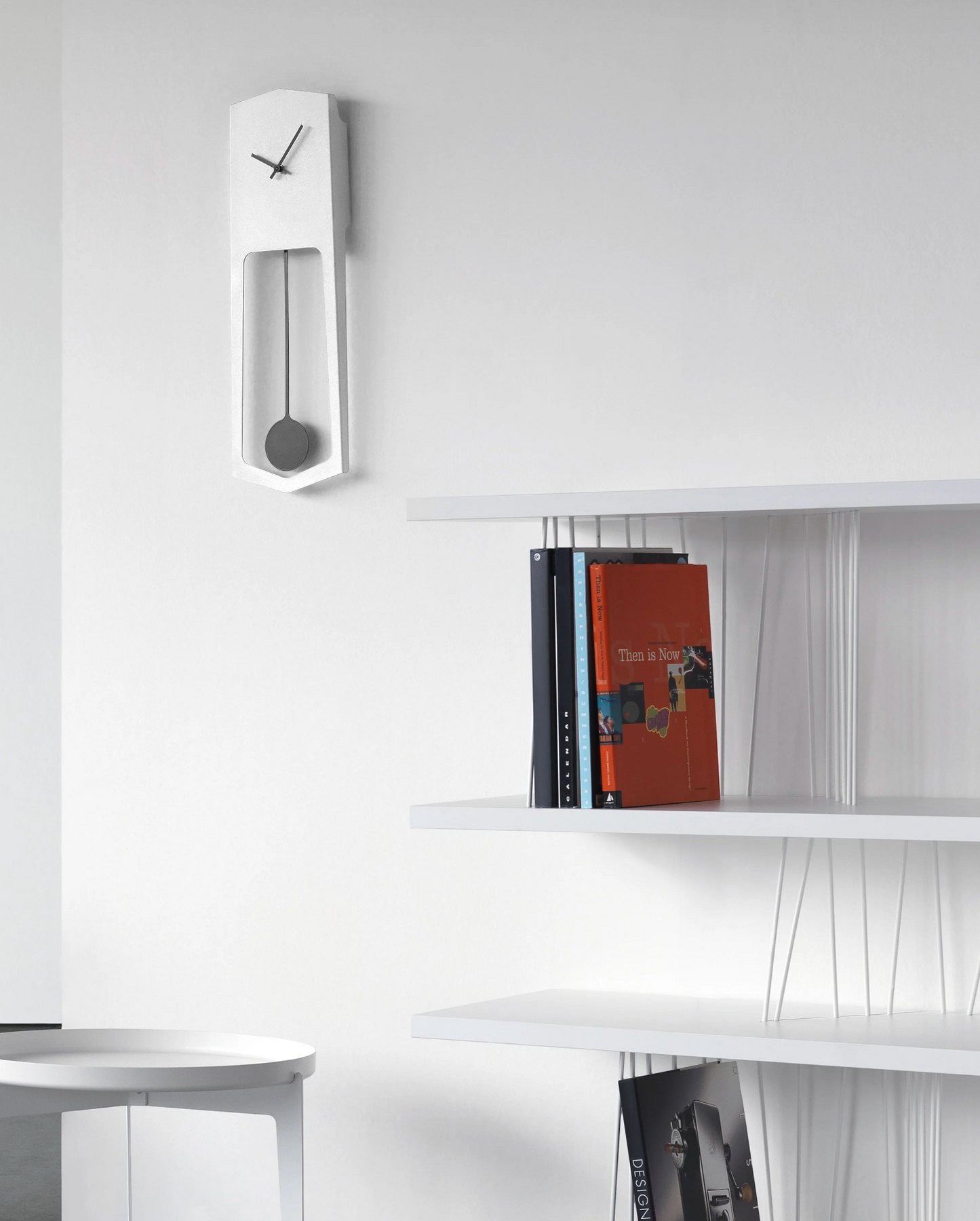 COVO / Aika Wall Clock with Pendulum by Ari Kanevra